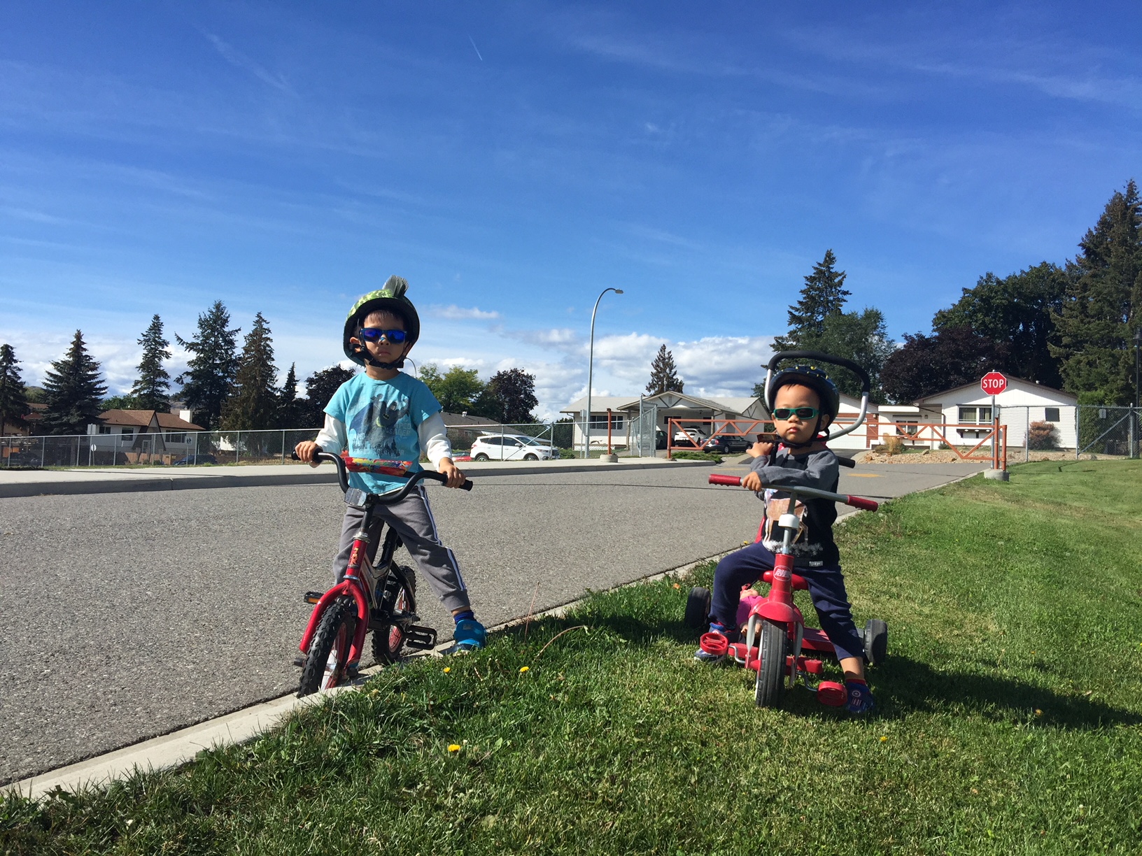 Kenny, 4 & Nicky, 2 learning to bike in their neighbourhood